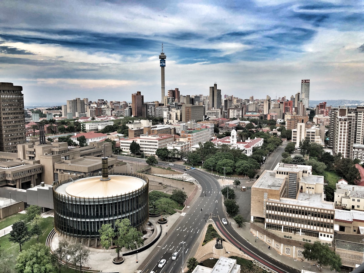 The Johannesburg city skyline at dusk with the Constitutional Hill in the foreground