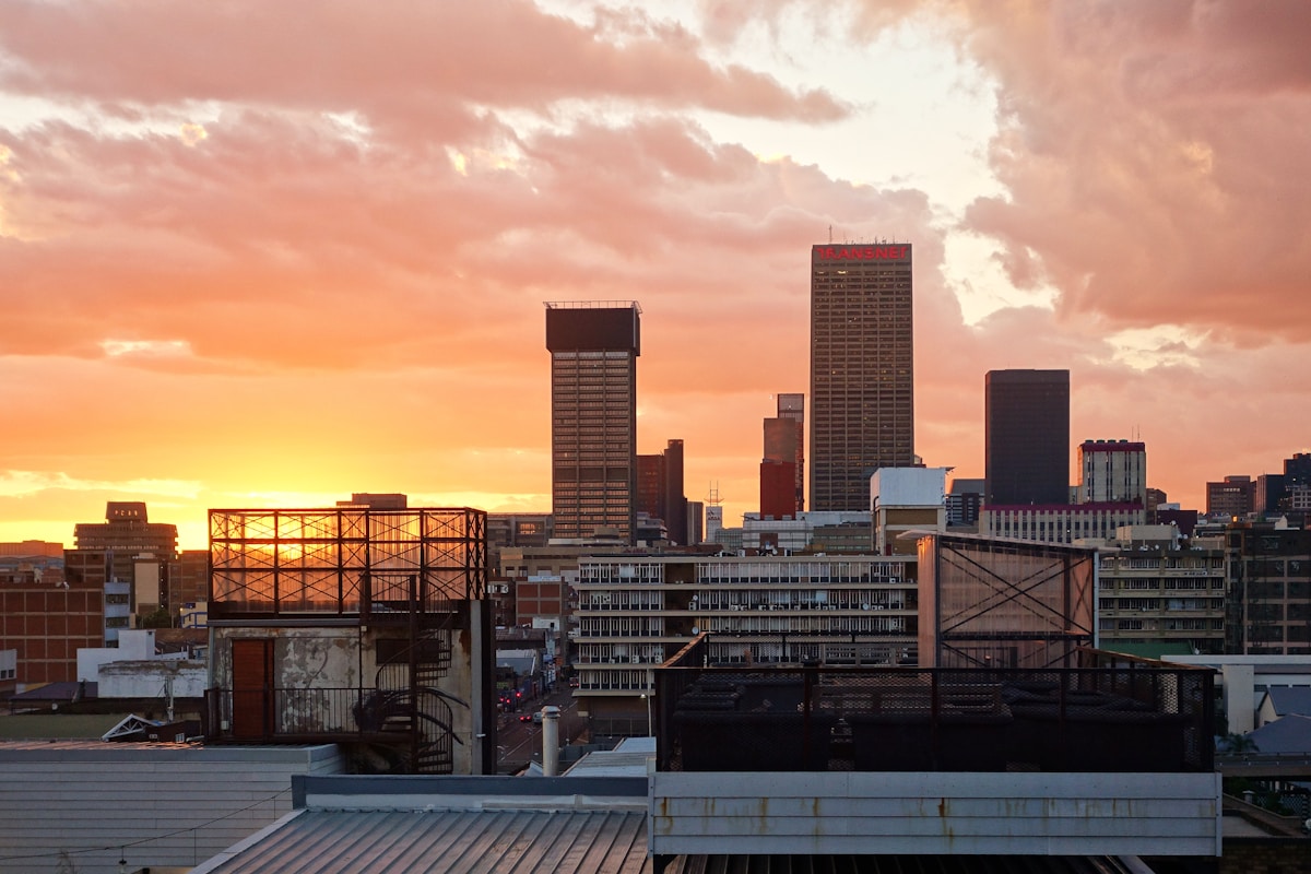 Sandton skyline at night with hotel towers and the Sandton City mall lights