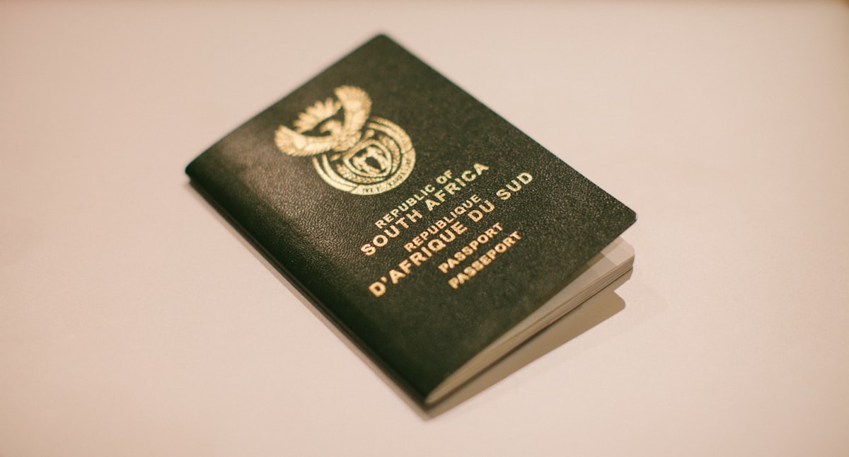 A South African passport control stamp and boarding pass